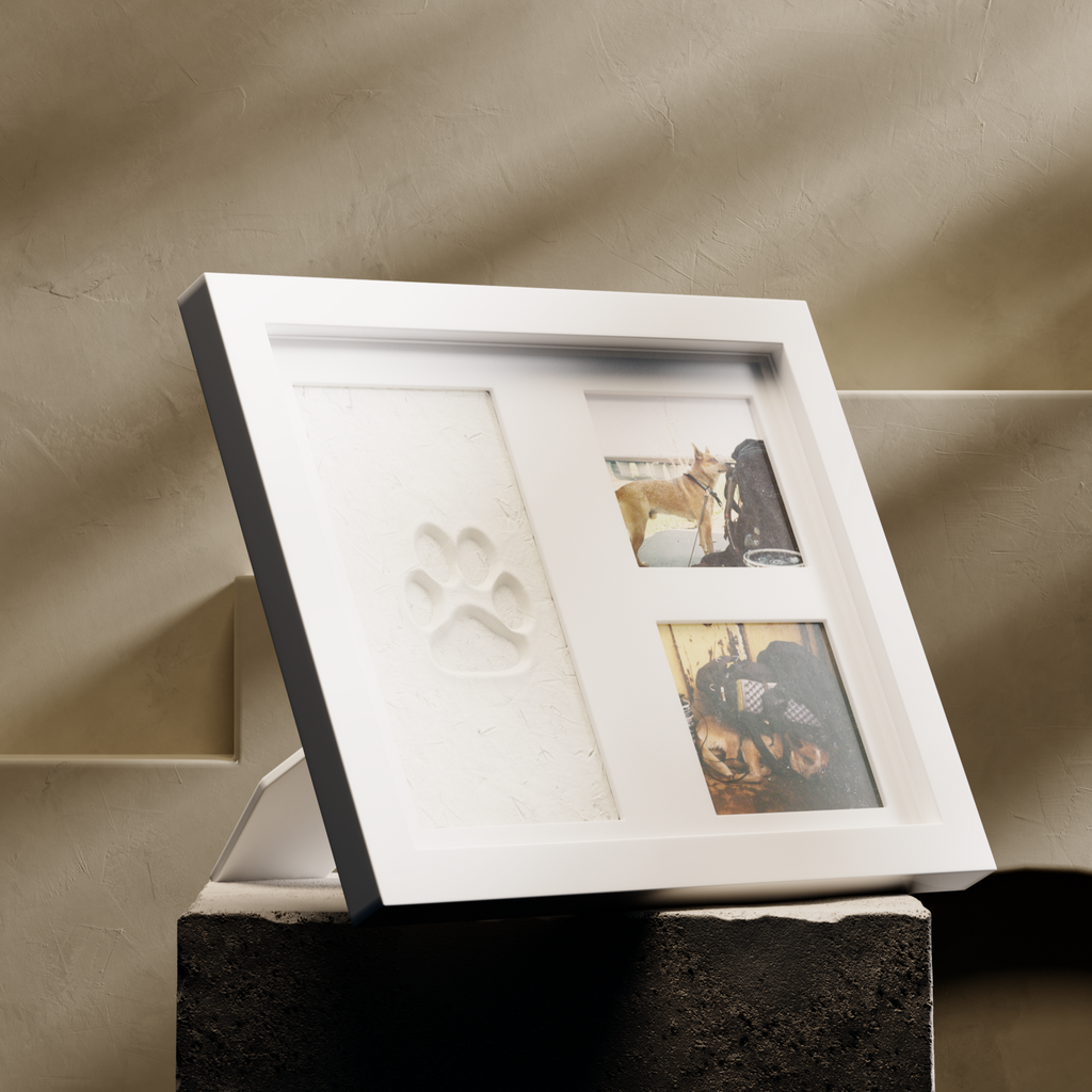 Framed artwork on a stand against a beige wall